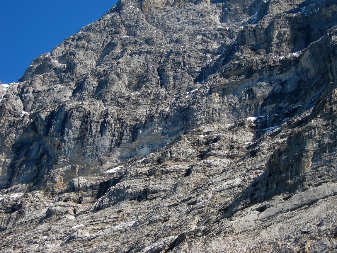 openings in the eiger cliff form tourist windows for users of the eigerwand train